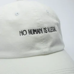 Gifts Under $30 | Caps & Beanies*Wear The Peace No Human Is Illegal Cap